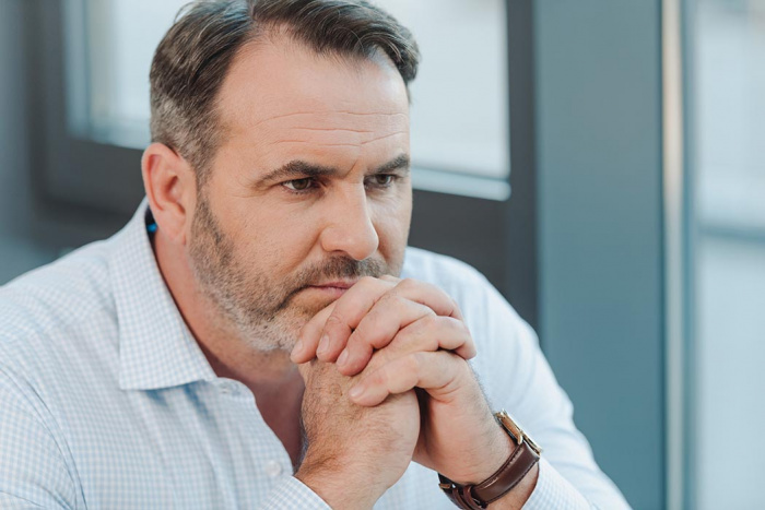 Businessperson deep in thought